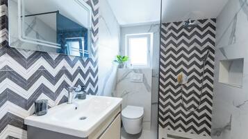 Shower, hair dryer, towels, soap
