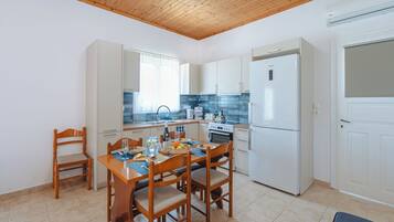 Family House, Multiple Bedrooms (To Pournari Beachside Garden House) | Private kitchen | Fridge, oven, stovetop, coffee/tea maker