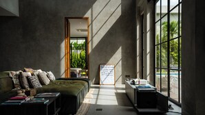 A modern bedroom with a large window, a bed, a desk, and a view of greenery outside. - Soul Moon Harmony - Harmony of Comfort and Nature (Kerobokan)
