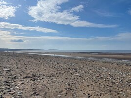 A rocky beach with a clear sky.