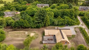 An aerial view of a rural property with multiple houses surrounded by dense forest. - "Ulf" - 2km from the sea by Interhome (Ulfborg)