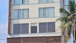 A multi-story building with a sign reading "PALACE HOTEL" on the facade. - HOTEL MAA LAXMI PALACE (Deoghar)