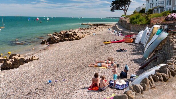A pebble beach with kayaks and a stone wall. - Lower Bouys in the seaside village of Seaview on the Isle of Wight (Seaview)