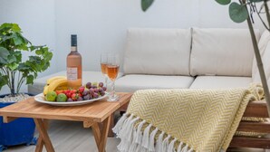 A wooden table with a bottle, glasses, and fruit. - Lower Bouys in the seaside village of Seaview on the Isle of Wight (Seaview)