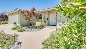 A residential house with a front yard, a driveway, and a mailbox. - Shop, Hike & Explore: Fresno Home w/ Private Pool! (Fresno)