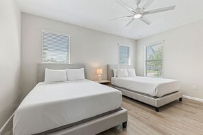 Bedroom 1 with 2 queen size beds and a private bathroom - Stylish Getaway•Pool•Game Room•Near Disney (Kissimmee)