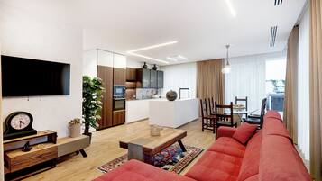 Suite Luxury, vista mare | Area soggiorno | TV