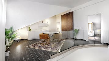 Suite de lujo, balcón | Área de sala de estar