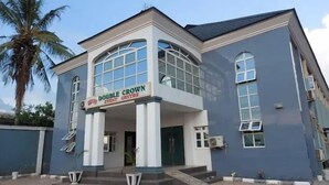 A building with a sign reading "DOUBLE CROWN EVENT CENTRE". - Double Crown Hotels (Abeokuta)