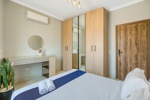 Desk, iron/ironing board, free WiFi, bed sheets - Cozy & Calm 1BR | Balcony Views in Lotus | Travelholic Stay (Lotus)