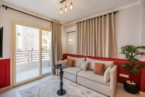 Living area - The Ruby 1BR | Elegant Stay in Lotus | Travelholic Stays (Lotus)