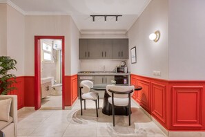 Fridge, microwave, stovetop, dining tables