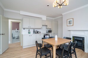 Coffee/tea maker, electric kettle, dining tables