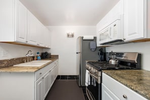 Condo, 2 Bedrooms | Private kitchen | Fridge, oven, coffee/tea maker, toaster