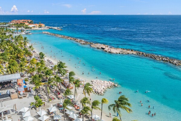 On the beach, sun-loungers, beach towels