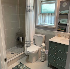 Shower, hair dryer, towels, soap