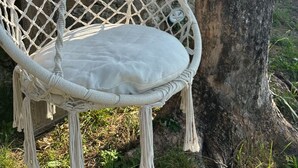 A white macrame hanging chair with a cushion, attached to a tree. - Carina in Toscana, garden apartment with private pool in beautiful Garfagnana. (Colognola)