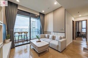 Luxury Apartment, 2 Bedrooms, City View | Living area | 24-inch flat-screen TV with cable channels - The Lumiere Riverside luxury Apartment (Ho Chi Minh City)