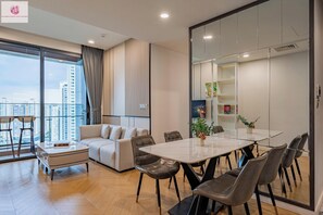 Luxury Apartment, 2 Bedrooms, City View | Living area | 24-inch flat-screen TV with cable channels