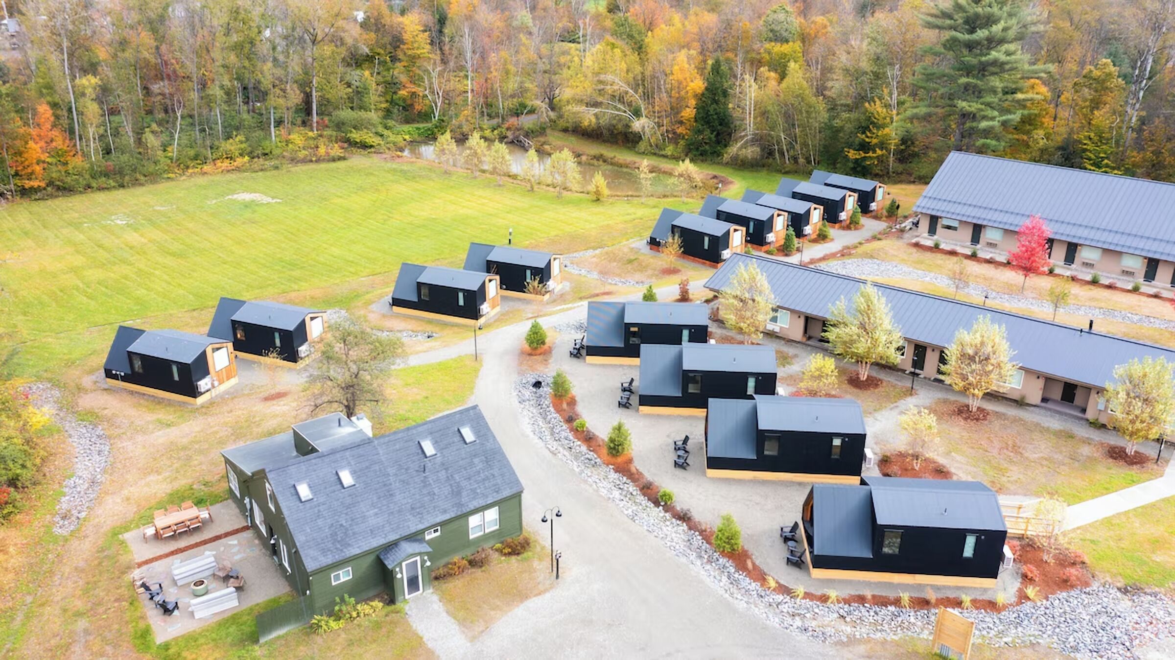 Picture peaceful strolls between modern cabins and forest views.