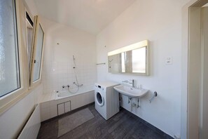 Shower, hair dryer, towels, shampoo