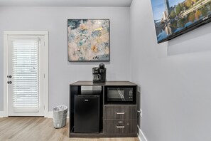 A compact kitchenette with a refrigerator, microwave, and coffee maker. - Sevierville Studio for Two | Modern Walk-in Shower (Sevierville)