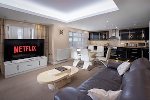 10 Queen Suite 5-Star, 3 Bedrooms, Sea View, Beachfront (plus 1 free baby) | Living area | 50-inch Smart TV with digital channels, Netflix, streaming services - Granada Apartments Queens Mansions (Blackpool)