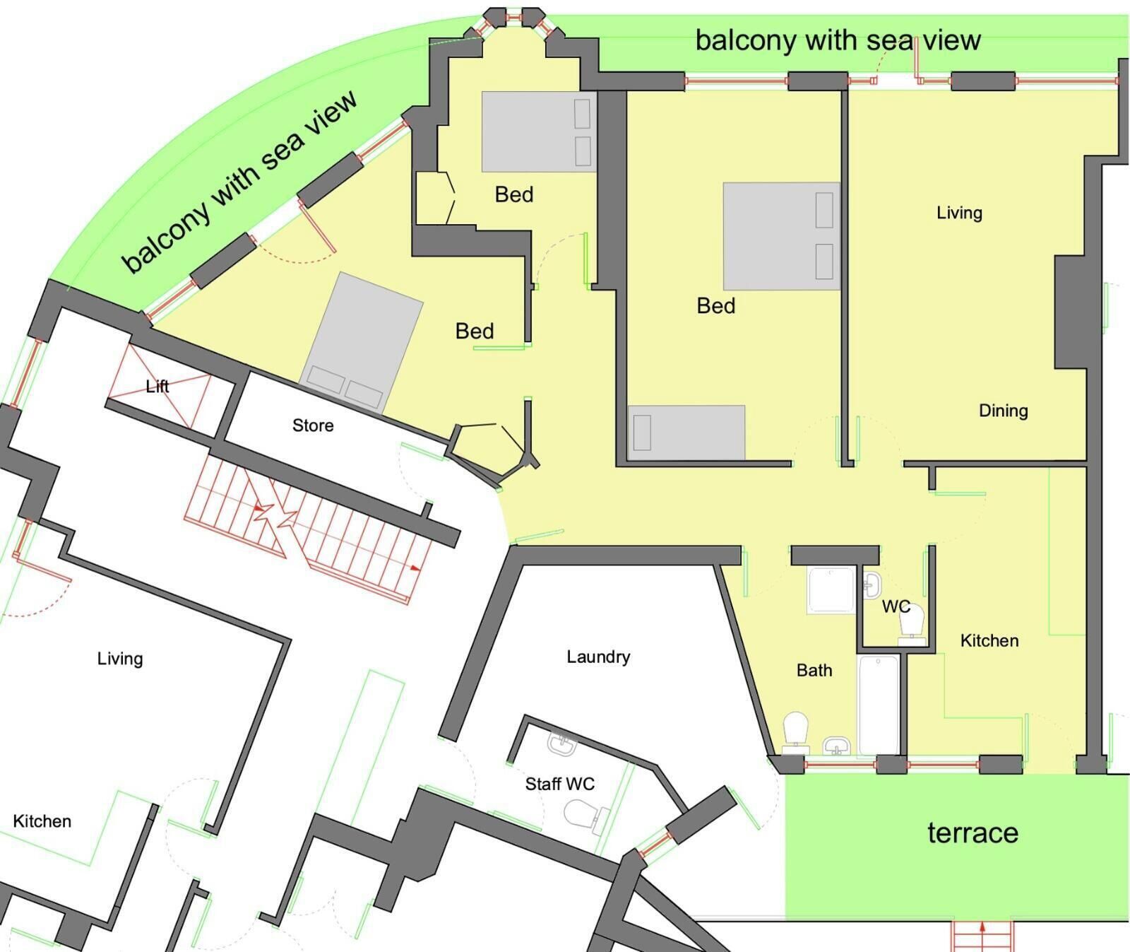 Et hotel layout med balkon og havudsigt, terrasse, flere soveværelser, spiseområde, opholdsstue, køkken, badeværelse, vaskerum og personaletoilet.