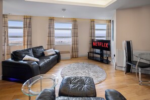 11 Lakeland Suite 4-Star, 1 Bedroom, Sea View, Beachfront (plus 1 free baby) | Living area | 50-inch Smart TV with digital channels, Netflix, streaming services - Granada Apartments Queens Mansions (Blackpool)