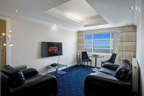 09 Clitheroe Suite 4-Star, 1 Bedroom, Sea View, Beachfront (plus 1 free baby) | Living area | 50-inch Smart TV with digital channels, Netflix, streaming services - Granada Apartments Queens Mansions (Blackpool)