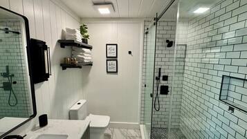 Shower, hair dryer, towels, soap