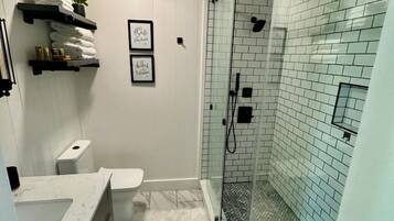 Shower, hair dryer, towels, soap