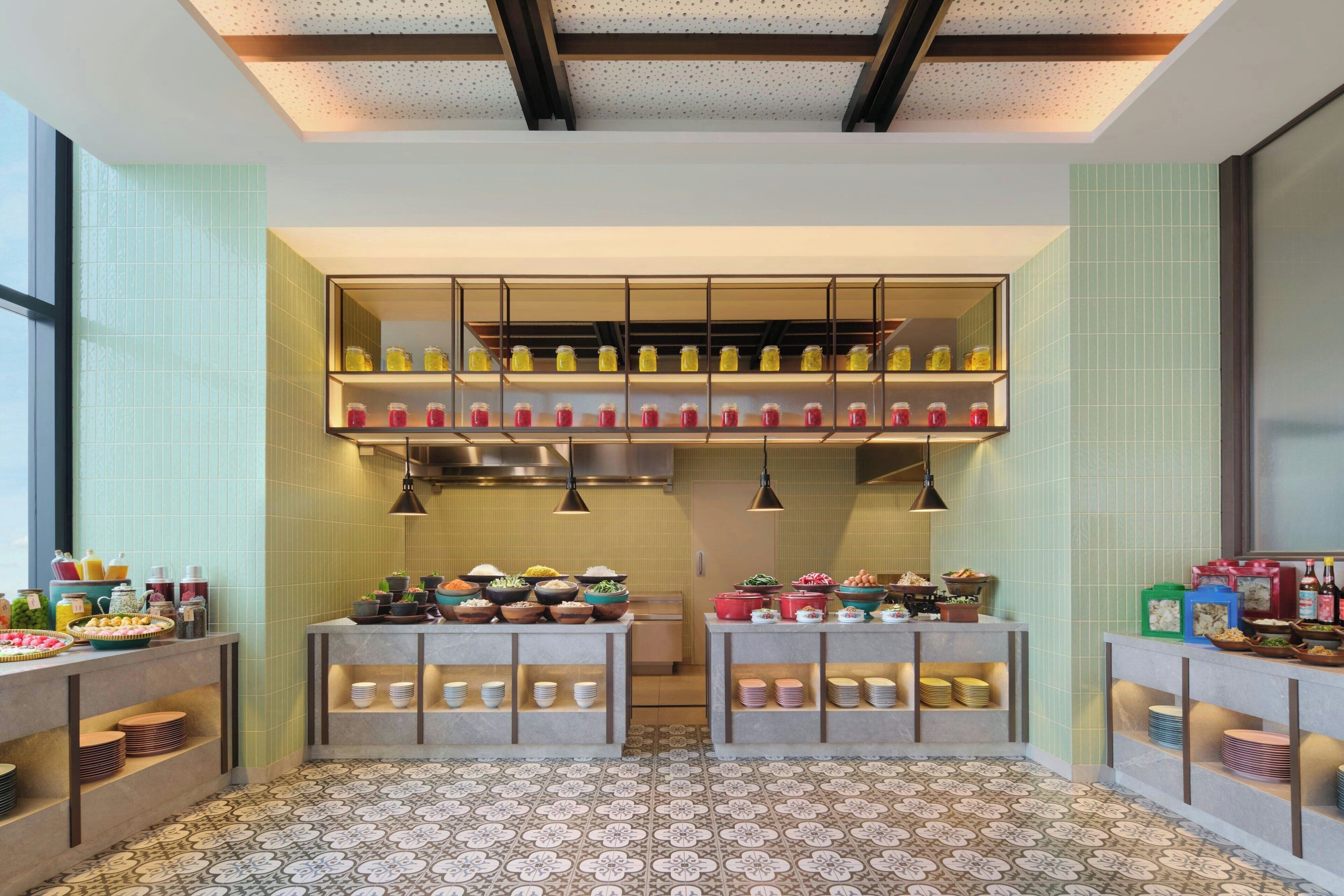 A modern kitchen with a central island, two side counters, and a ceiling with exposed beams.
