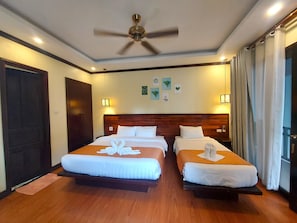 Triple Room, Courtyard View | In-room safe, blackout drapes, soundproofing, iron/ironing board