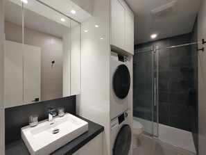 Shower, hair dryer, towels, soap