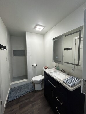 Shower, towels, soap, toilet paper