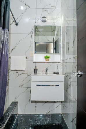 Shower, hair dryer, towels, soap