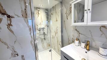 Shower, hair dryer, towels