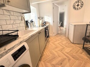 Fridge, microwave, coffee/tea maker, toaster