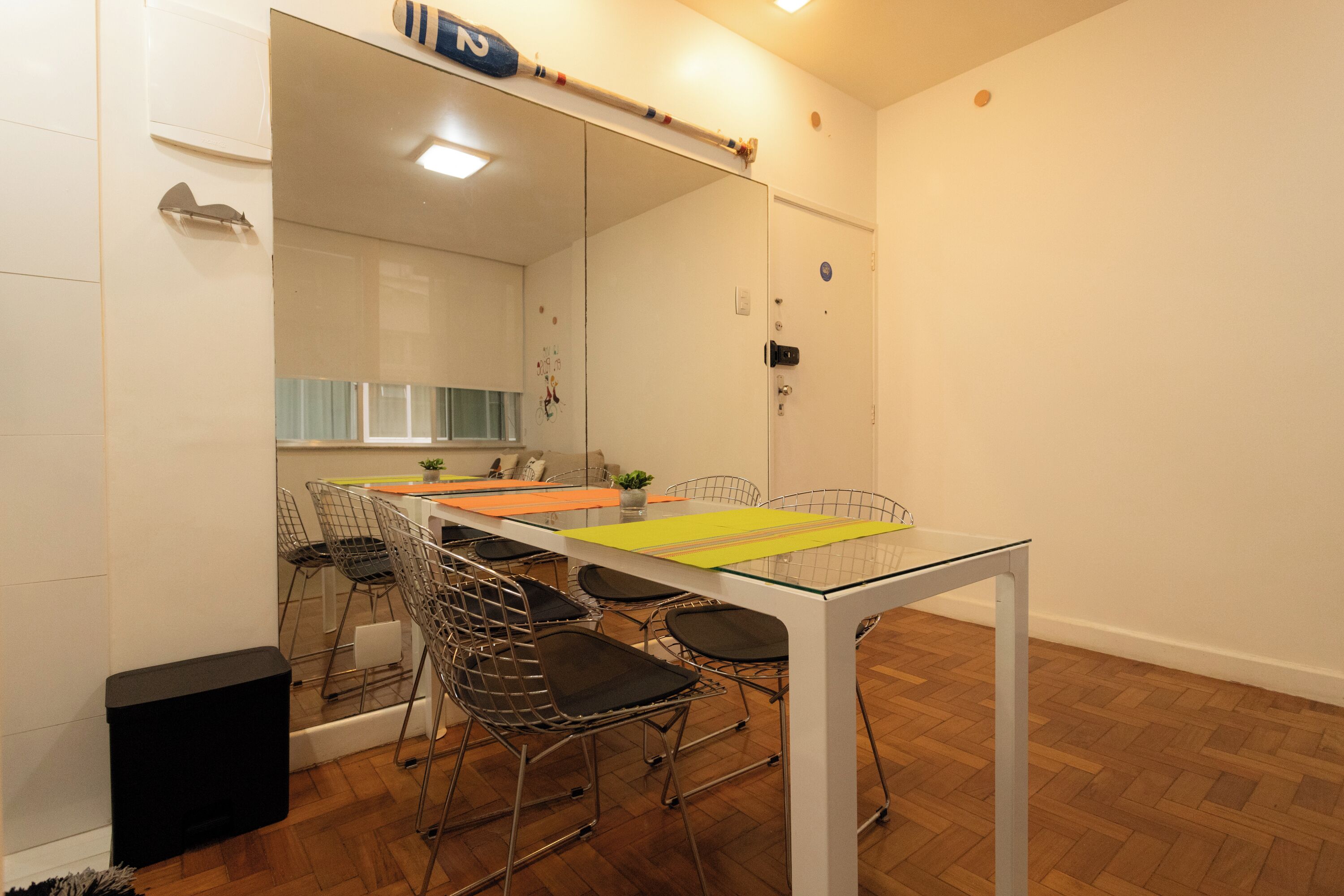 A modern kitchen with white cabinets, a stainless steel sink, and a wooden countertop.