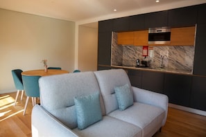 Comfort Apartment, 2 Bedrooms, City View | Living area | 43-inch LCD TV with cable channels