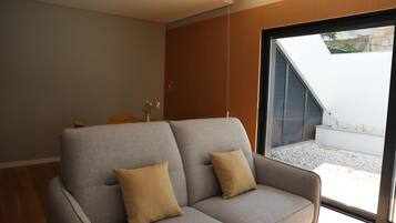 Comfort Apartment, 1 Bedroom, Patio, City View | Living area | 43-inch LCD TV with cable channels