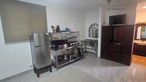 A compact kitchen with a refrigerator, stove, and sink. - Chic studio with WiFi and AC in phenomenal Playa Hermosa (Playa Hermosa)