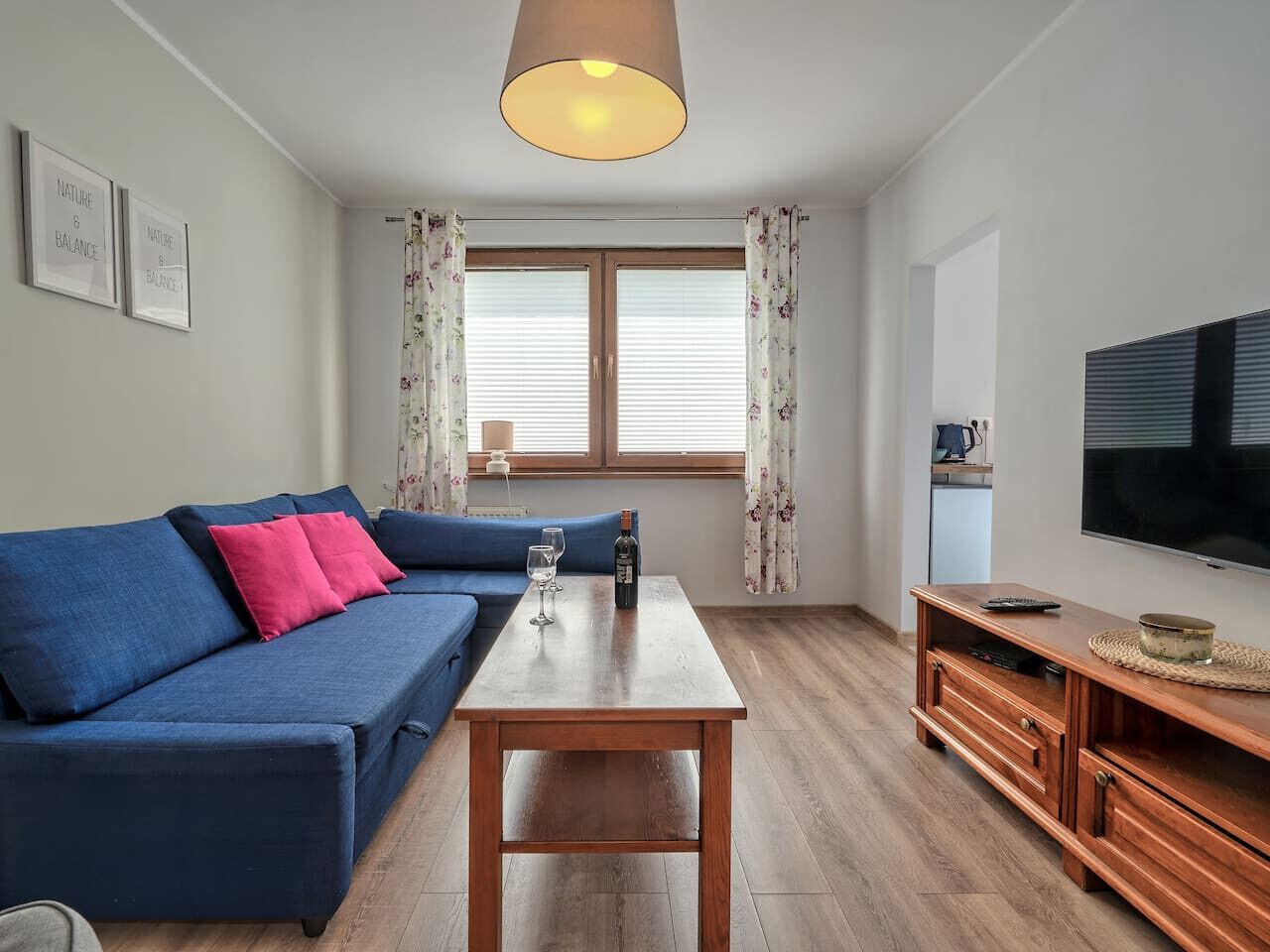 Living Area with Sofa Bed, Dining Table and Smart TV | Book Now with RENTUJEMY.COM