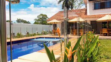 Outdoor pool, pool umbrellas, sun loungers