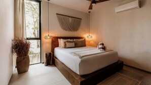 A bedroom with a bed, ceiling fan, bedside lamps, and a window with curtains. - Casa Chacalaca Perfect Bachelorette Villa (Tulum)