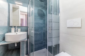 Shower, slippers, towels, soap