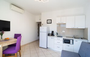 Fridge, microwave, coffee/tea maker, cookware/dishes/utensils