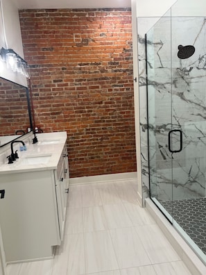 Shower, towels, soap, toilet paper