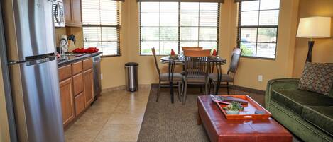 A compact living space with a kitchen, dining area, and seating area.